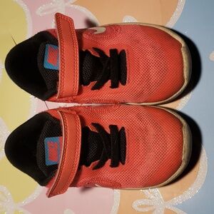 Pink and blue Nike revolution 3